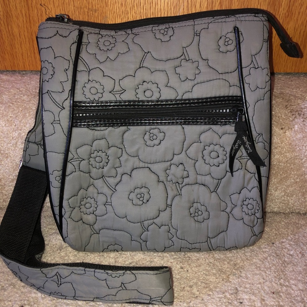 Grey Thirty- One Grey floral quilted purse.